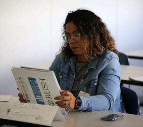 jessica holding a rush binder