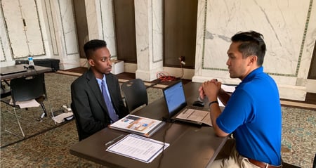 job seeker interviewing at hiring event