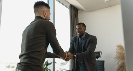 job seeker shaking hands with employer