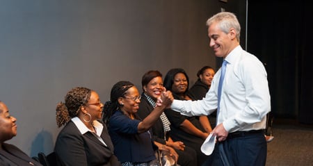 Mayor Emanuel shaking hands with woman