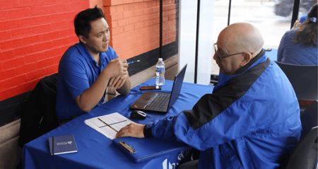Skills recruiter interviewing a candidate at a hiring event