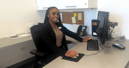 Ashli works at her desk