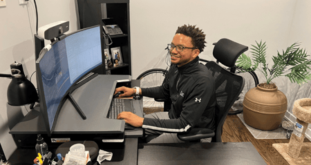 Walter works at his desk at home