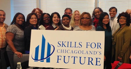 group holding sign with skills logo
