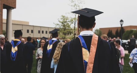 group of graduates in caps and gowns