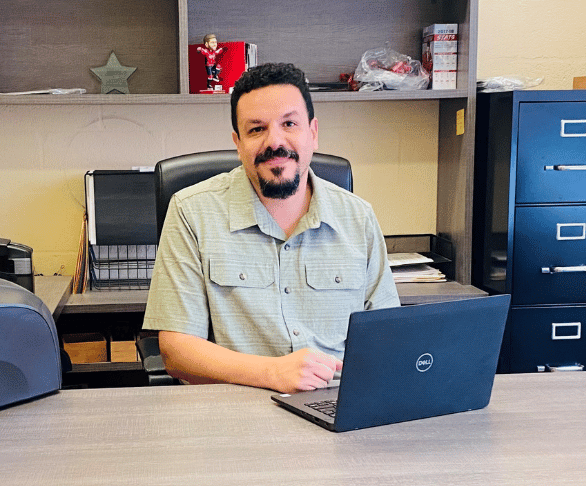 Miguel at his desk