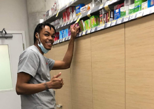 Quinton working at Walgreens pharmacy